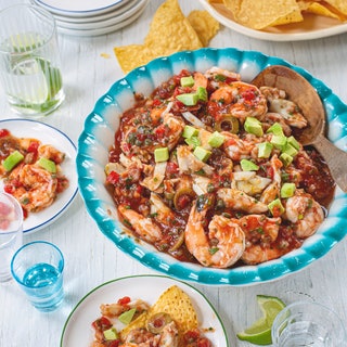 Seafood cocktail in a large bowl with diced avocado.