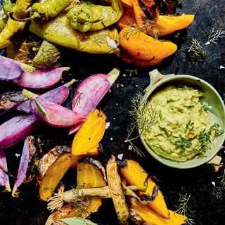 Crudites with grilled green goddess dip colorful vegetables green dip in a small bowl