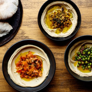 Three bowls of hummus